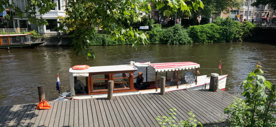 small private canal boat Delphine Amsterdam for canal ride ...